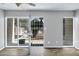 Empty living space with wood-look floors and a sliding glass door to the outdoor area at 1828 W Tuckey Ln # 13, Phoenix, AZ 85015