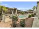Community pool surrounded by well-maintained landscaping and multiple building balconies at 1828 W Tuckey Ln # 13, Phoenix, AZ 85015