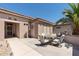 Cozy back patio with a dining set, perfect for outdoor entertaining and relaxation at 20394 N Coronado Way, Surprise, AZ 85374