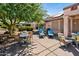 Enjoy outdoor living with a spacious patio, comfortable lounge chairs, and lush desert landscaping in this inviting backyard oasis at 20394 N Coronado Way, Surprise, AZ 85374