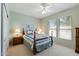 Cozy bedroom with two windows and a ceiling fan for added comfort and efficient climate control at 20394 N Coronado Way, Surprise, AZ 85374