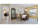 Lovely dining room with natural lighting and view into the living room at 20394 N Coronado Way, Surprise, AZ 85374