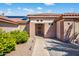 Charming single-story home featuring a tile roof, desert landscaping, and an inviting entrance at 20394 N Coronado Way, Surprise, AZ 85374