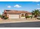 Inviting single-Gathering home with a well-maintained lawn, desert landscaping, tile roof, and a two-car garage at 20394 N Coronado Way, Surprise, AZ 85374