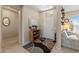 Welcoming foyer with neutral colors, patterned rug, and easy access to other living spaces at 20394 N Coronado Way, Surprise, AZ 85374