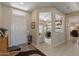Inviting foyer with tile flooring, a view to the office, and access to a cozy living space at 20394 N Coronado Way, Surprise, AZ 85374