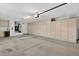 Garage with epoxy flooring, lots of storage cabinets, and utilities at 20394 N Coronado Way, Surprise, AZ 85374