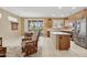 Open kitchen and dining area with stainless steel appliances and access to the outdoor patio at 20394 N Coronado Way, Surprise, AZ 85374