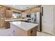 Modern kitchen with stainless steel appliances, island, and lots of cabinet space at 20394 N Coronado Way, Surprise, AZ 85374