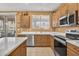 Clean, fully-equipped kitchen with stainless steel appliances and generous counter space at 20394 N Coronado Way, Surprise, AZ 85374