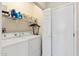 Functional laundry room equipped with a washer, dryer, and shelving for storage at 20394 N Coronado Way, Surprise, AZ 85374