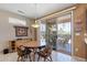 Dining area with sliding glass doors leading to the backyard and patio, features natural light and furniture at 20394 N Coronado Way, Surprise, AZ 85374