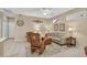 Bright living room with a neutral sofa, rocking chair, and stylish accents at 20394 N Coronado Way, Surprise, AZ 85374