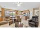 Spacious living area with a modern floor plan, access to the backyard, and an eat-in kitchen at 20394 N Coronado Way, Surprise, AZ 85374