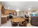 Open-concept floor plan with eat-in kitchen and living area, ideal for gatherings and featuring plenty of seating at 20394 N Coronado Way, Surprise, AZ 85374