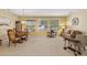 Bright living area featuring ample seating, large windows, and stylish decor at 20394 N Coronado Way, Surprise, AZ 85374