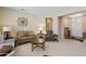 Open living room featuring neutral colors, tile floors, and comfortable seating at 20394 N Coronado Way, Surprise, AZ 85374