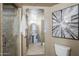 Modern bathroom featuring a walk-in shower, a pedestal sink, and a decorative mirror at 21 E 6Th St # 316, Tempe, AZ 85281