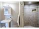 Bright bathroom with a pedestal sink, a tiled walk-in shower, and neutral finishes at 21 E 6Th St # 316, Tempe, AZ 85281