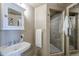 Charming bathroom with a pedestal sink, a walk-in shower, and soft lighting at 21 E 6Th St # 316, Tempe, AZ 85281