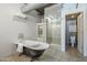 Elegant bathroom with a clawfoot tub, a glass shower, and classic fixtures at 21 E 6Th St # 316, Tempe, AZ 85281