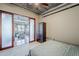 Stylish bedroom with a partial view of the living room, a modern wardrobe, and exposed ceiling at 21 E 6Th St # 316, Tempe, AZ 85281