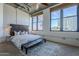 Modern bedroom with exposed concrete ceiling, large windows, and dark wood accents at 21 E 6Th St # 316, Tempe, AZ 85281
