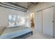 Cozy bedroom with neutral decor, a comfortable bed, and a sliding door closet at 21 E 6Th St # 316, Tempe, AZ 85281
