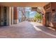 The covered entranceway between brick buildings and manicured landscaping provides access to the structure at 21 E 6Th St # 316, Tempe, AZ 85281