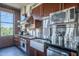 Gourmet kitchen featuring stainless steel appliances, custom cabinetry, exposed brick walls, and a modern design at 21 E 6Th St # 316, Tempe, AZ 85281