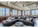 Stylish living room with industrial touches, large sectional sofa, exposed brick, lots of natural light, and custom built-ins at 21 E 6Th St # 316, Tempe, AZ 85281