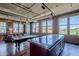 Stylish living room with a wet bar island adjacent to a gourmet kitchen area with exposed brick and industrial ductwork at 21 E 6Th St # 316, Tempe, AZ 85281
