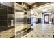 Elegant lobby boasts a stainless steel elevator, secure mailboxes, and upscale tile flooring and classic decor at 21 E 6Th St # 316, Tempe, AZ 85281