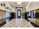Grand entrance lobby featuring secure mailboxes, tile flooring, sophisticated lighting, and a decorative entry door at 21 E 6Th St # 316, Tempe, AZ 85281