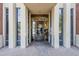 Close-up view of the Orchidhouse entrance with a decorated glass door and brick walkway at 21 E 6Th St # 316, Tempe, AZ 85281