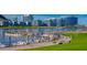 Scenic waterfront with docks, boats, and modern buildings in the background under a clear sky at 21 E 6Th St # 316, Tempe, AZ 85281
