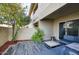 Serene backyard with tiled patio, comfortable seating, and lush landscaping at 2142 E Turney Ave # 9, Phoenix, AZ 85016