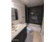 Modern bathroom with single sink vanity, toilet, shower and tub at 2142 E Turney Ave # 9, Phoenix, AZ 85016