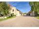 Beautiful townhouse exterior with brick driveway, grass, and lush greenery at 2142 E Turney Ave # 9, Phoenix, AZ 85016