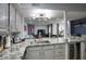 Bright kitchen with granite countertops, stainless steel appliances, and an open view to the living area at 2142 E Turney Ave # 9, Phoenix, AZ 85016