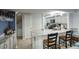 Open-concept kitchen with granite countertops, breakfast bar, and modern appliances at 2142 E Turney Ave # 9, Phoenix, AZ 85016