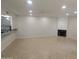 Open living room with tile flooring, fireplace, ceiling fan, and recessed lighting at 2142 E Turney Ave # 9, Phoenix, AZ 85016