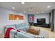 Cozy living room featuring a corner fireplace, large sectional couch, and modern decor at 2142 E Turney Ave # 9, Phoenix, AZ 85016