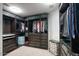 Well-organized walk-in closet with custom shelving, drawers, and ample hanging space for clothes at 2142 E Turney Ave # 9, Phoenix, AZ 85016