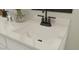 Close-up of a bathroom vanity showcasing a sleek undermount sink, modern faucet, and stylish countertop at 23404 W Burton Ave, Buckeye, AZ 85326