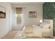 Inviting bedroom with a bed, a gallery wall, natural light, and botanical wall art at 23404 W Burton Ave, Buckeye, AZ 85326