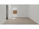 Simple bedroom with a built-in closet and a single window, creating a functional and uncluttered space at 23404 W Burton Ave, Buckeye, AZ 85326