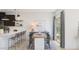 Contemporary dining area featuring a wooden table, stylish seating, and sliding door access to outdoor scenery at 23404 W Burton Ave, Buckeye, AZ 85326