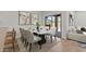 Elegant dining room with modern furniture and sliding glass door at 23404 W Burton Ave, Buckeye, AZ 85326