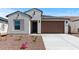 Charming home featuring a low-maintenance landscape and a two-car garage at 23404 W Burton Ave, Buckeye, AZ 85326